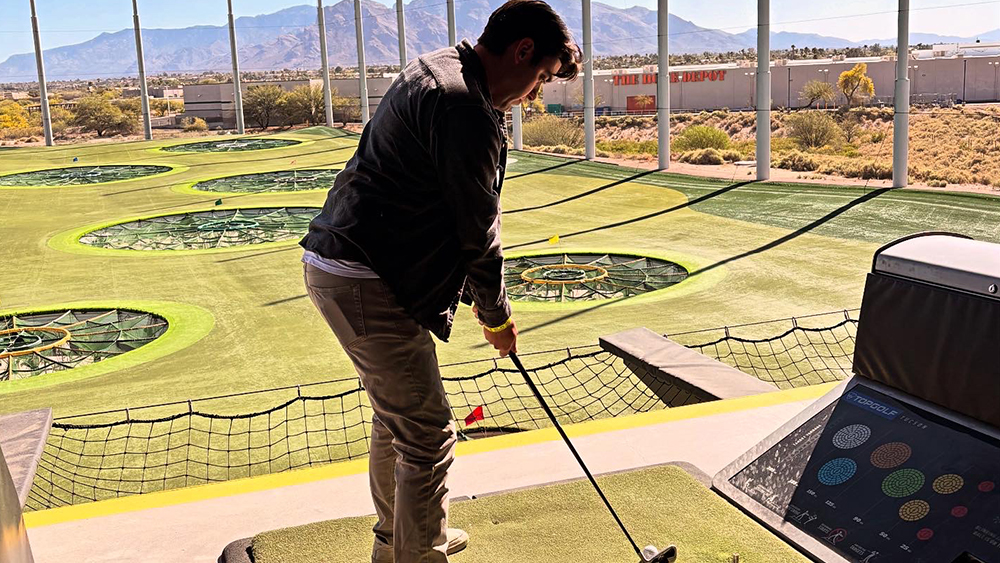 Teacher Playing Golf at Fore the Love of Tee-chers Event