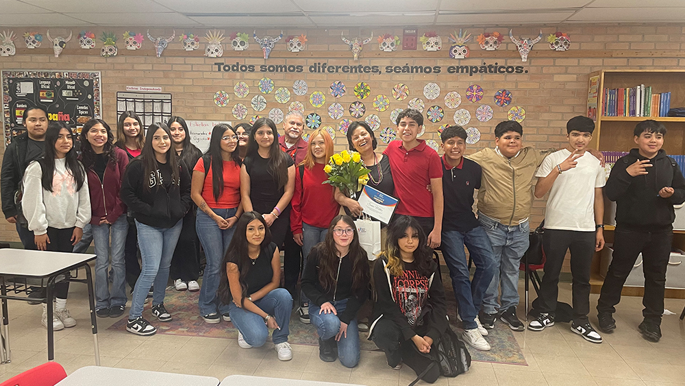 Teacher celebrating award with students